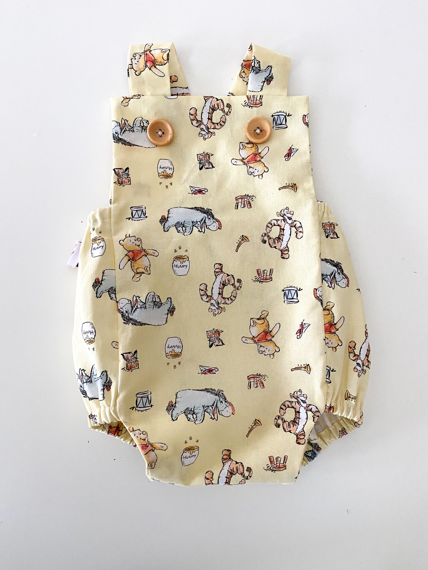 Winnie the Pooh yellow baby romper