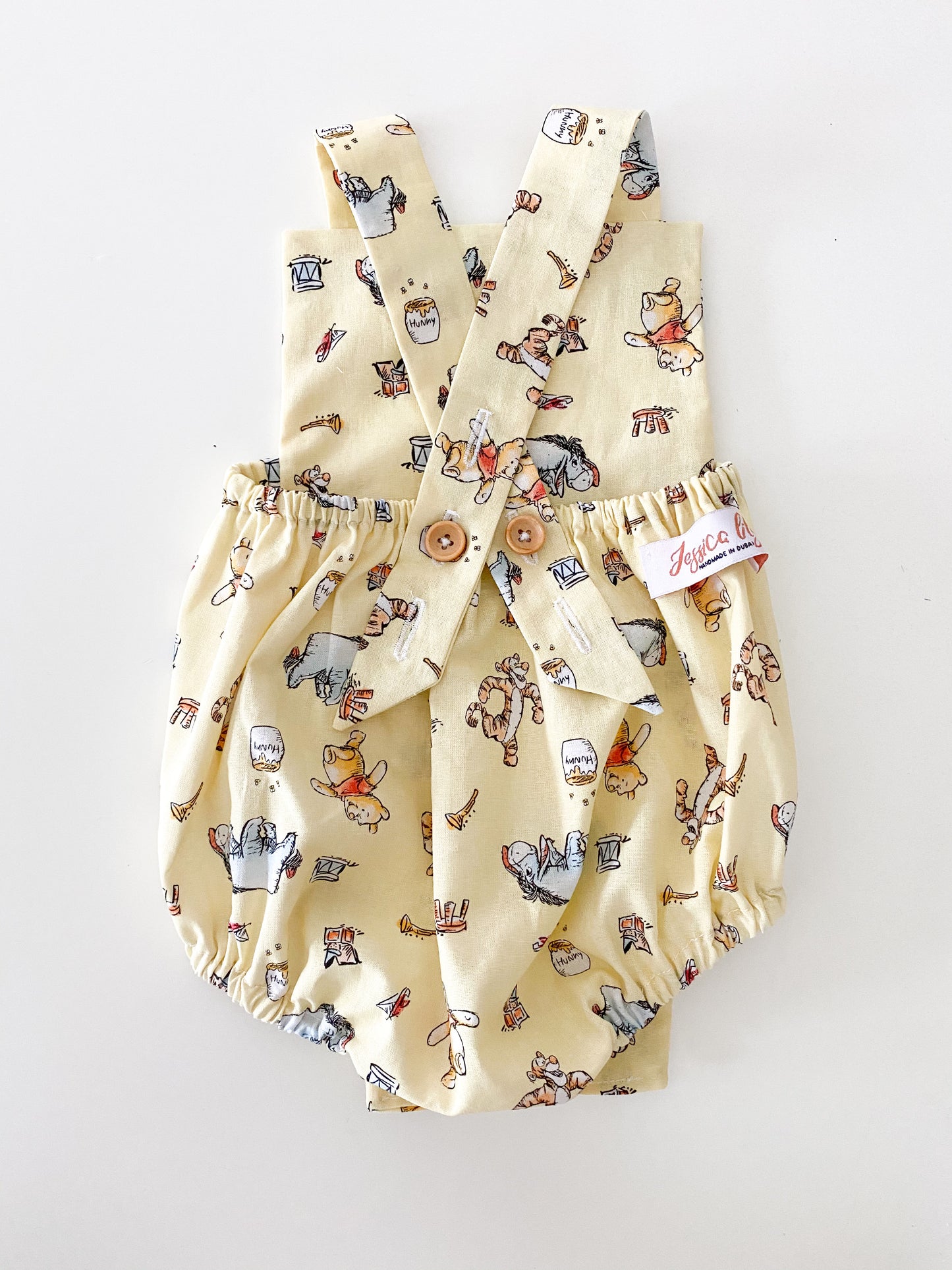 Winnie the Pooh yellow baby romper